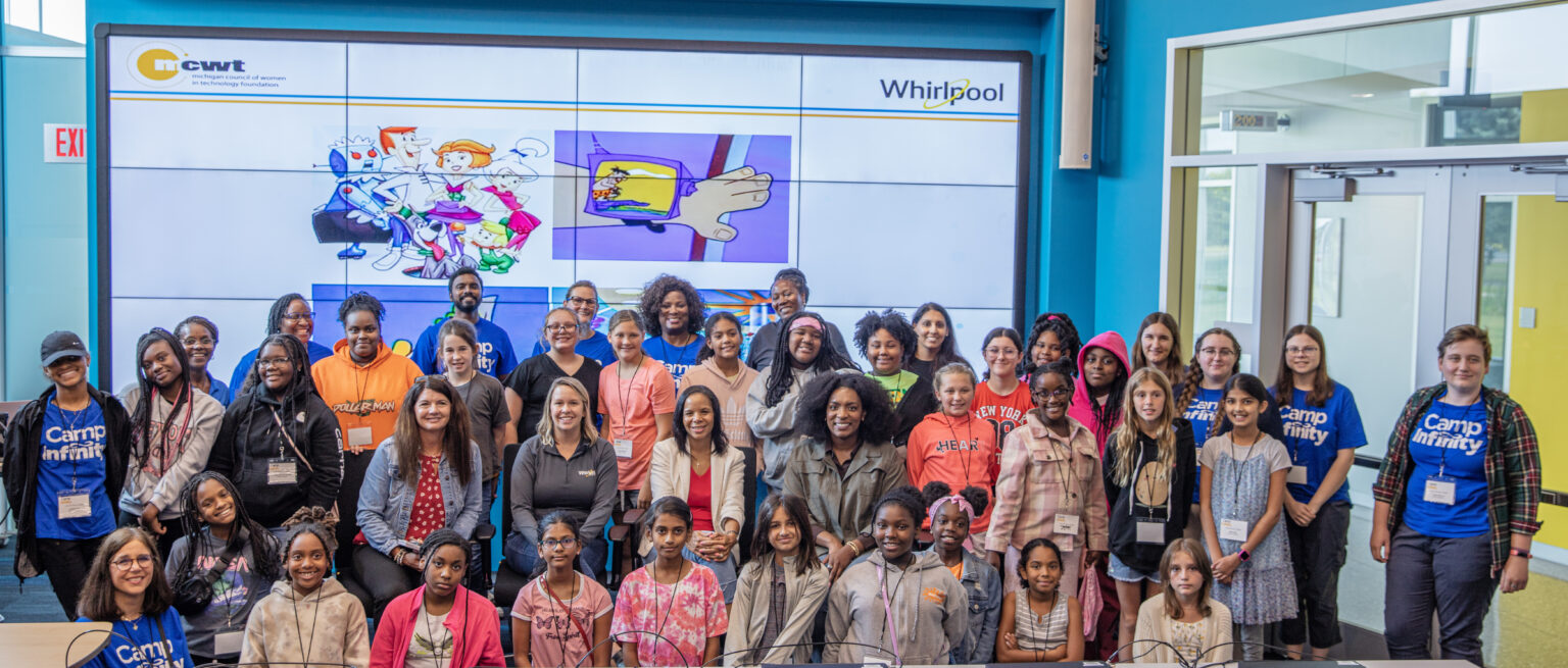 Group shot of young women attendees and professional women in tech career panelists