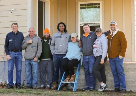 Volunteer crew supporting Maya and her son building their Habitat home