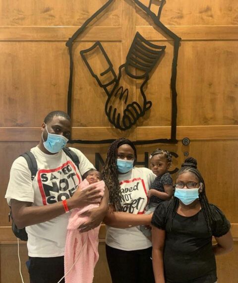 Jermonte and family standing at Ronald McDonald House