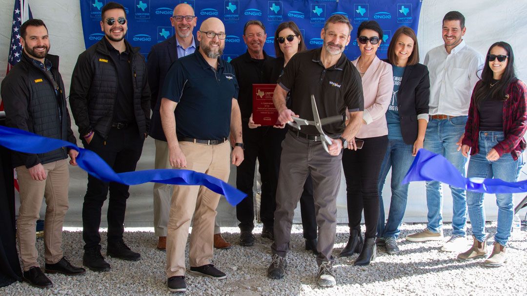 Whirlpool team cutting a ribbon as they break ground at the Limestone Wind wind farm in Dawson Texas