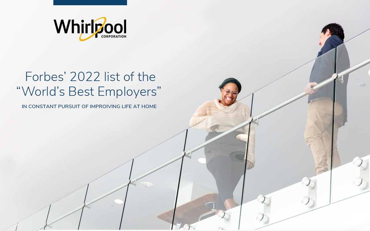 Two whirlpool employees chatting on balcony of headquarters, announcing Forbes 2022 List of Best Employers